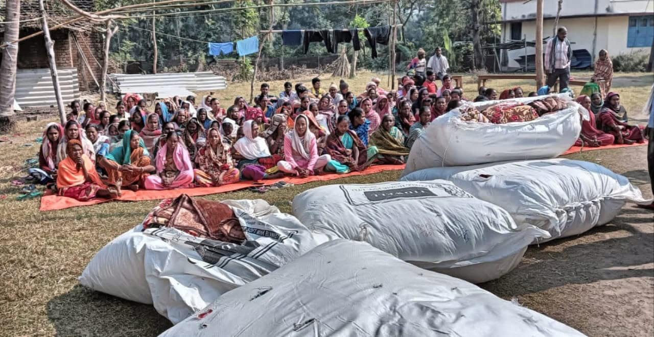 Villagers receiving blankets