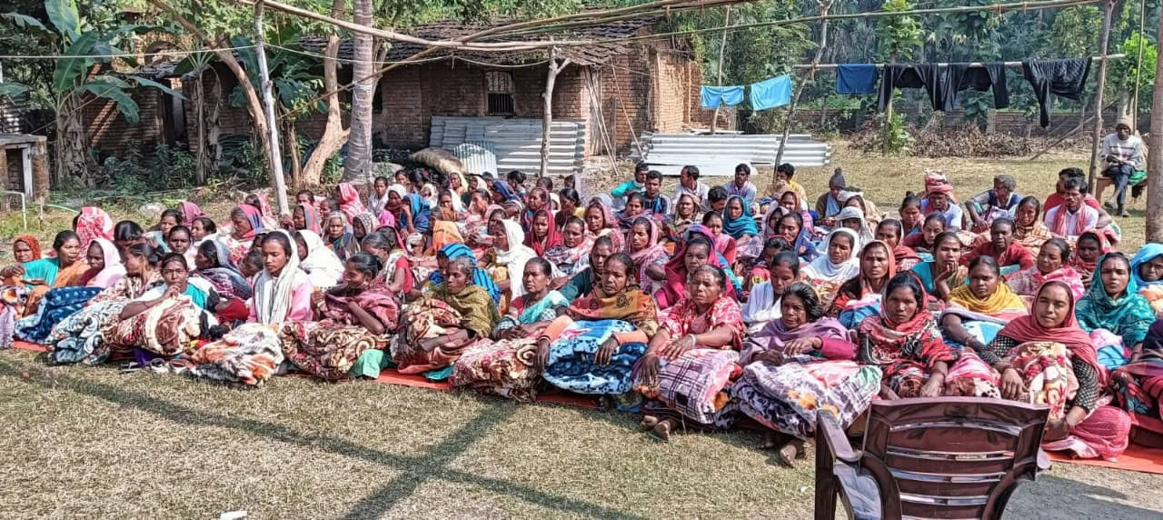 Villagers with blankets